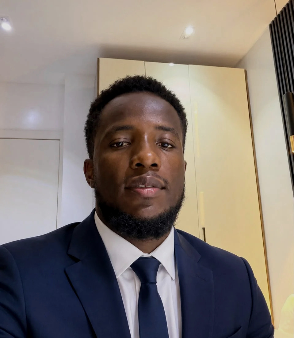 Collins Eburu in a navy suit